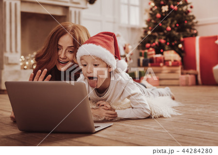 Emotional family watching funny videos on the laptop Emotional family watching funny videos on the laptop 44284280