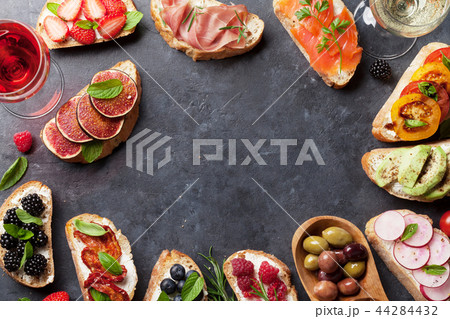 Brushetta or traditional spanish tapas. Appetizers 44284432