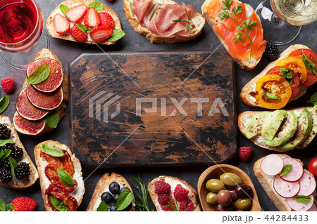 Brushetta or traditional spanish tapas. Appetizers 44284433