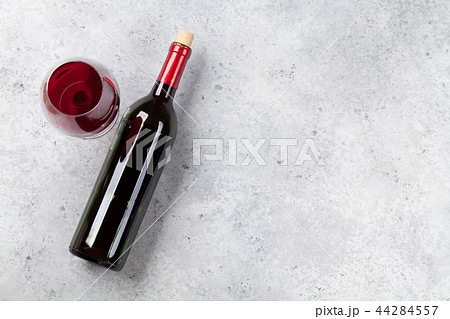 Red wine bottle and glass 44284557