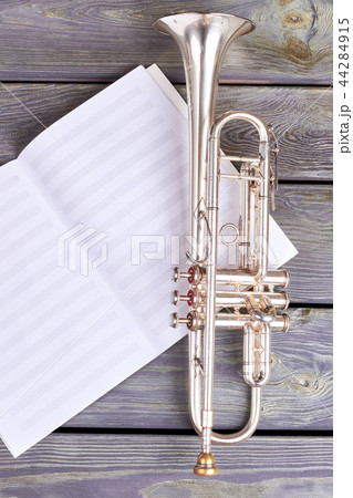 Trumpet on musical notes. Trumpet on musical notes. 44284915