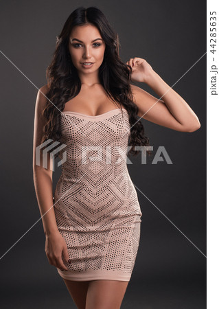 beautiful young woman in a tight shiny dress 44285635