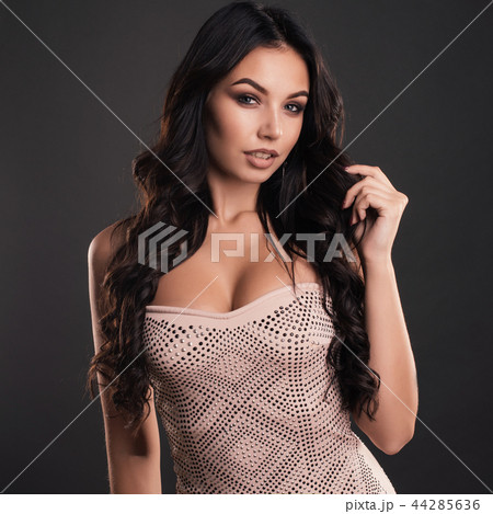 portrait of beautiful young woman with long hair  44285636