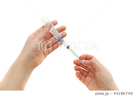 Syringe with ampoule in his hand girl 44286749