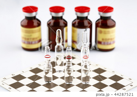 Ampoules on chess board, bottles with medicine 44287521