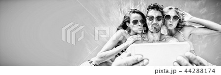 Happy friends taking selfie Happy friends taking selfie 44288174