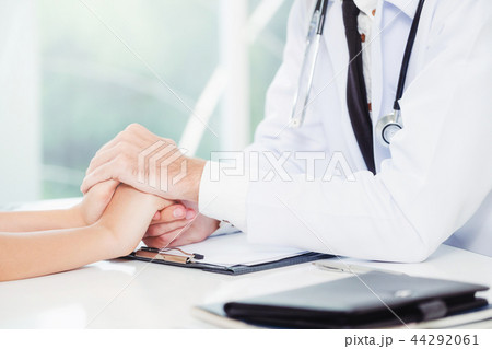 Male Doctor and Female Patient in Hospital Office 44292061