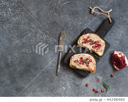 Two sandwiches with chicken pate and pomegranate  44296460
