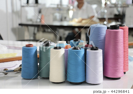 thread in spool on the tailor desk 44296841