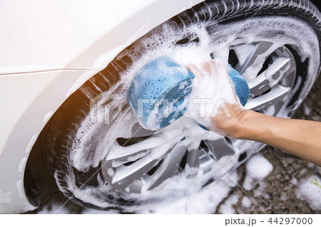 Hand image is holding sponge and car wash. Hand image is holding sponge and car wash. 44297000