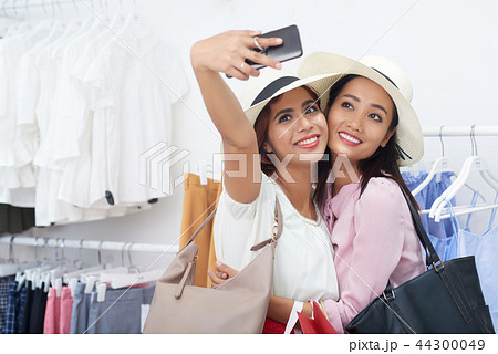 Taking selfie with friend Taking selfie with friend 44300049