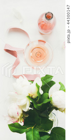 Greeting card concept with rose wine and peony flowers Greeting card concept with rose wine and peony flowers 44300147