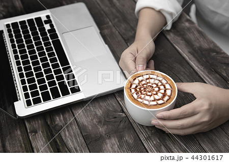 hot coffee on wood table with laptop hot coffee on wood table with laptop 44301617