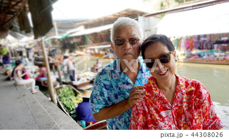 Asian senior couple enjoy thailand floating market Asian senior couple enjoy thailand floating market 44308026