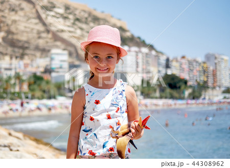 Little girl on Postiguet beach Little girl on Postiguet beach 44308962