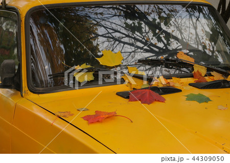 Time To Update concept. Front side of yellow car Time To Update concept. Front side of yellow car 44309050