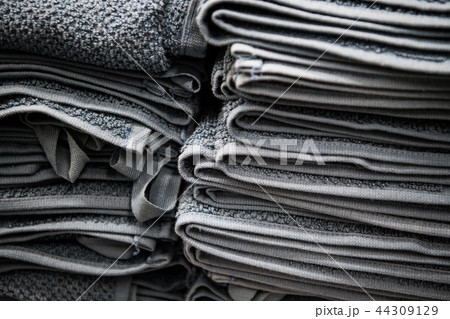 Natural pure linen towels, napkins on tablecloth. Small business. Pile of striped white grey linen 44309129