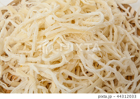 Dried shredded squid on a white background Dried shredded squid on a white background 44312033