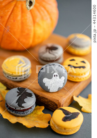 Halloween scary cookies with pumpkin on wooden cut board. pattern Bat , patina, ghosts and spiders Halloween scary cookies with pumpkin on wooden cut board. pattern Bat , patina, ghosts and spiders 44314600