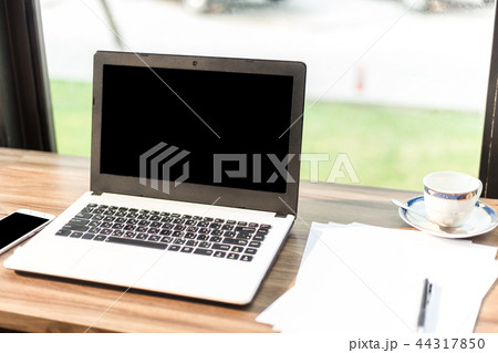 laptop with blank white screen of In the coffee sh laptop with blank white screen of In the coffee sh 44317850