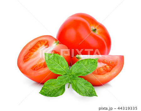 whole and half tomato with basil leaf isolated  44319335
