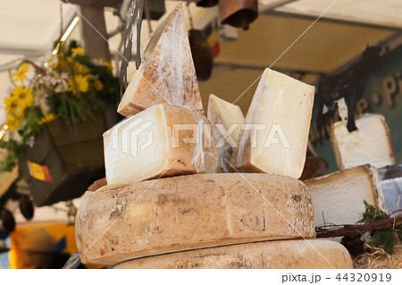 Cheeses and cut pieces in bulk on the counter Cheeses and cut pieces in bulk on the counter 44320919
