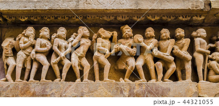 Stone carved bas-relief, Khajuraho temple, India Stone carved bas-relief, Khajuraho temple, India 44321055