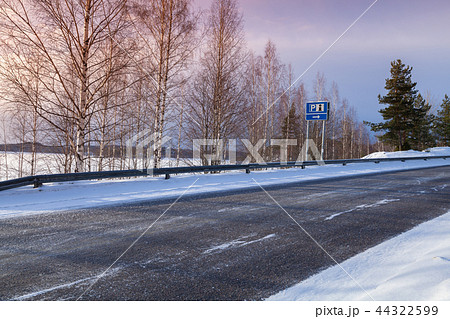 Empty rural road with information sign Empty rural road with information sign 44322599