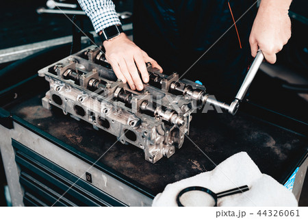 Young Auto Mechanic Twists A Nut. Service Station. Young Auto Mechanic Twists A Nut. Service Station. 44326061