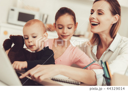 Mom And Daughter Are Playing With Little Baby. 44329014