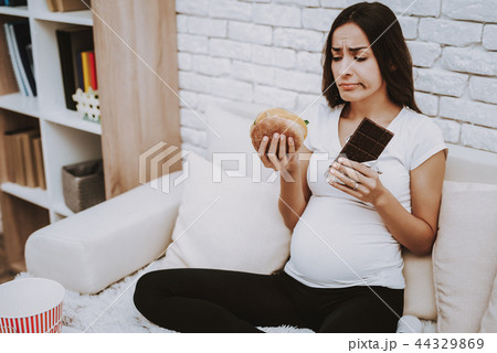 Home. Hungry. Grub. Pregnant Girl. Eat. Hamburger. 44329869