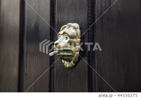 Old metal door knocker 44330275