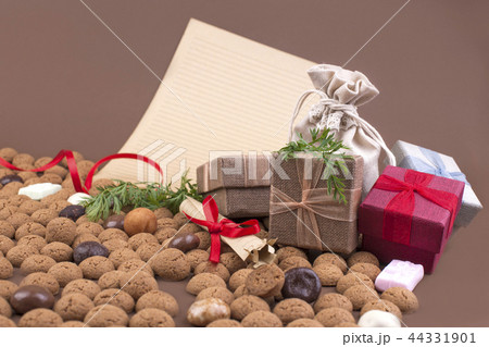 Dutch holiday Sinterklaas background with pepernoten.Traditional sweets and gifts for children for Dutch holiday Sinterklaas background with pepernoten.Traditional sweets and gifts for children for 44331901