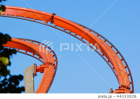 Rollercoaster against blue sky in the evening Rollercoaster against blue sky in the evening 44333026
