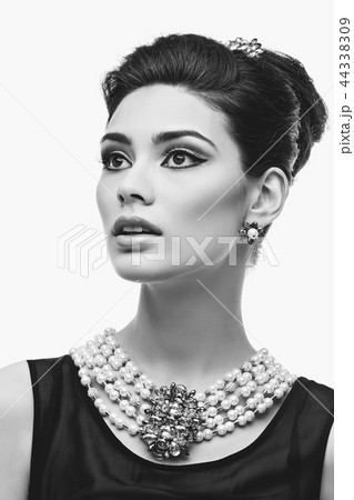 beautiful young woman in retro style isolated on white 44338309