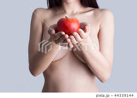 Sexy woman body with apple 44339144