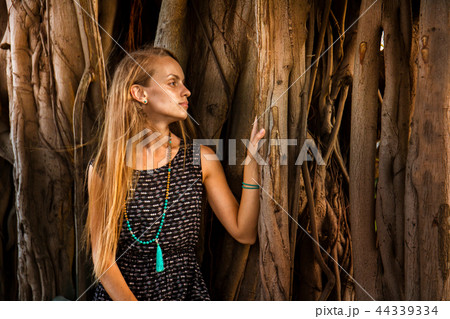 Young girl under the banyan tree Young girl under the banyan tree 44339334