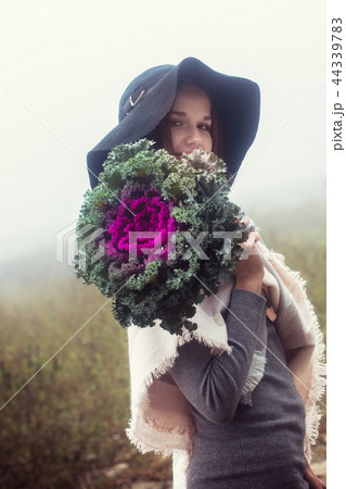 The woman covered her face The woman covered her face 44339783
