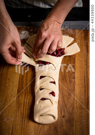 A woman is spinning a roll A woman is spinning a roll 44339900