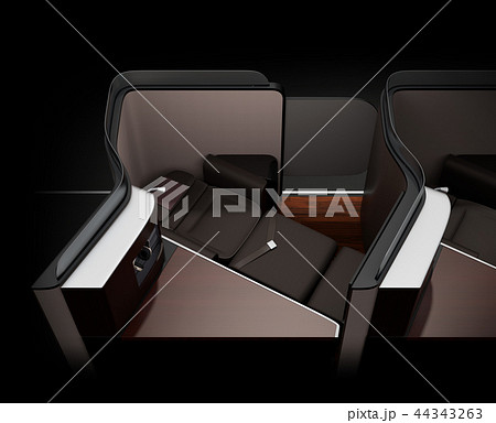 黒バックに個室型ビジネスクラススイートのフルフラットシート状態のイメージ。 44343263