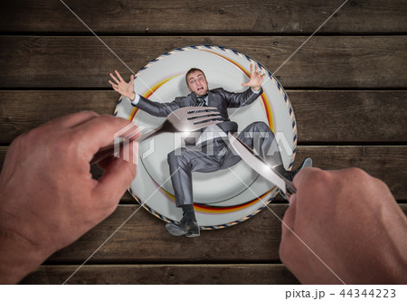 Businessman on a plate, small business problem Businessman on a plate, small business problem 44344223