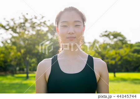 Portrait Of Beautiful Chinese Woman Ready For Exercise In Park Portrait Of Beautiful Chinese Woman Ready For Exercise In Park 44345744