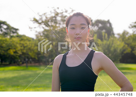 Portrait Of Beautiful Chinese Woman Ready For Exercise In Park Portrait Of Beautiful Chinese Woman Ready For Exercise In Park 44345748