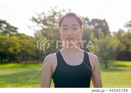 Portrait Of Beautiful Chinese Woman Ready For Exercise In Park Portrait Of Beautiful Chinese Woman Ready For Exercise In Park 44345749