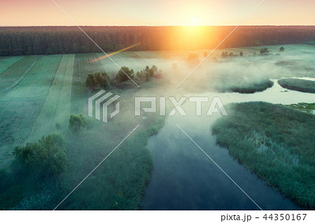 Early misty morning. Fog over the river at dawn Early misty morning. Fog over the river at dawn 44350167