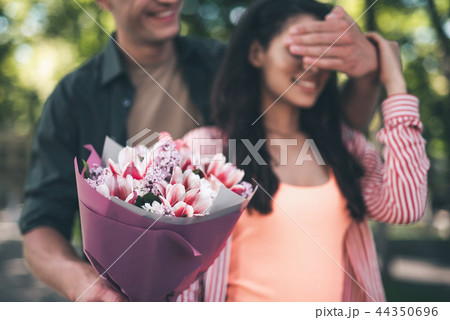 Beautiful flowers in the hands of kind loving man 44350696