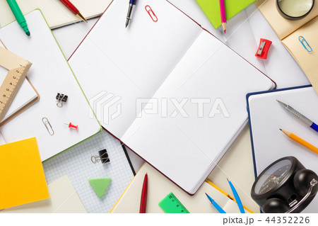 school accessories and open notebook or book school accessories and open notebook or book 44352226