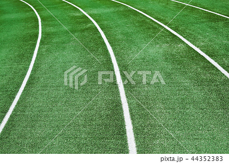 Empty running track with an artificial turf 44352383
