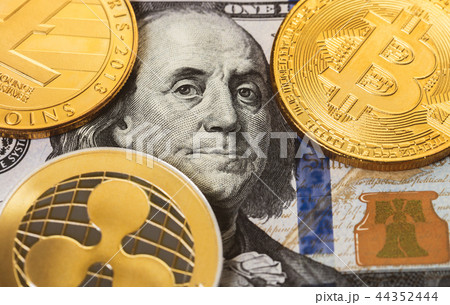 cryptocurrency and hundred dollar bills cryptocurrency and hundred dollar bills 44352444