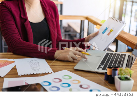 Young woman designer working as fashion designers at work with f 44353352